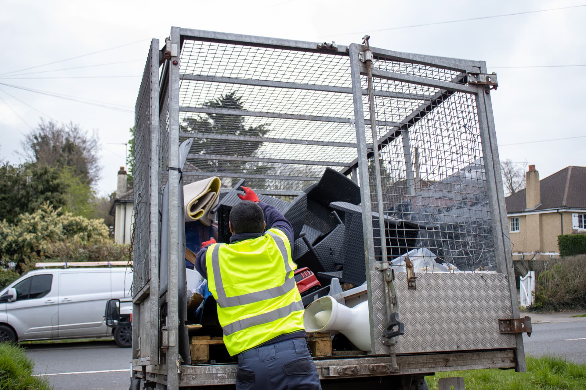 bulky waste collection Guildford workers loading household waste into truck