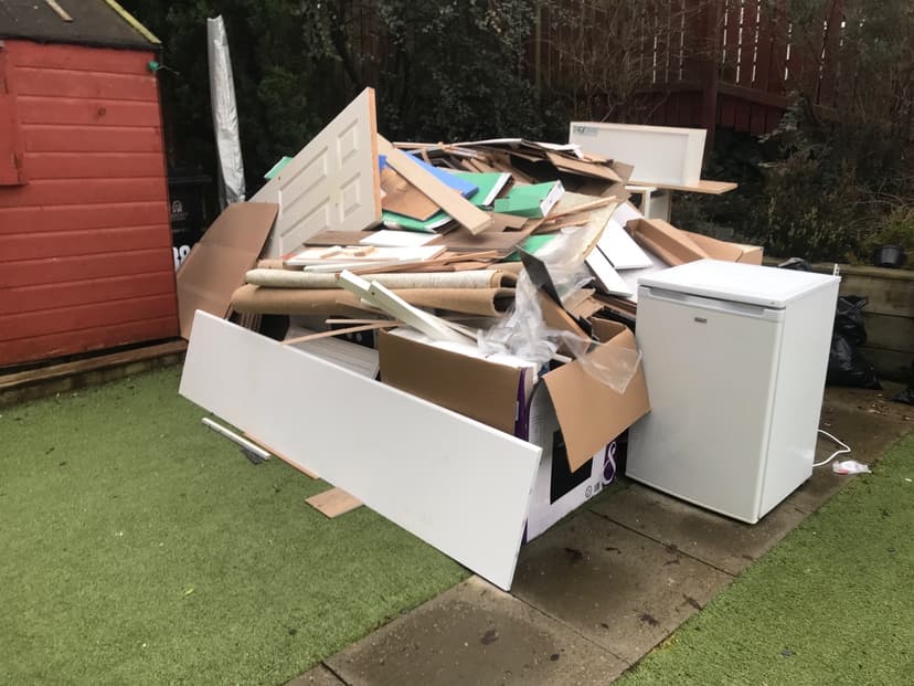 pile of household rubbish and bulky waste outside property in Oxford