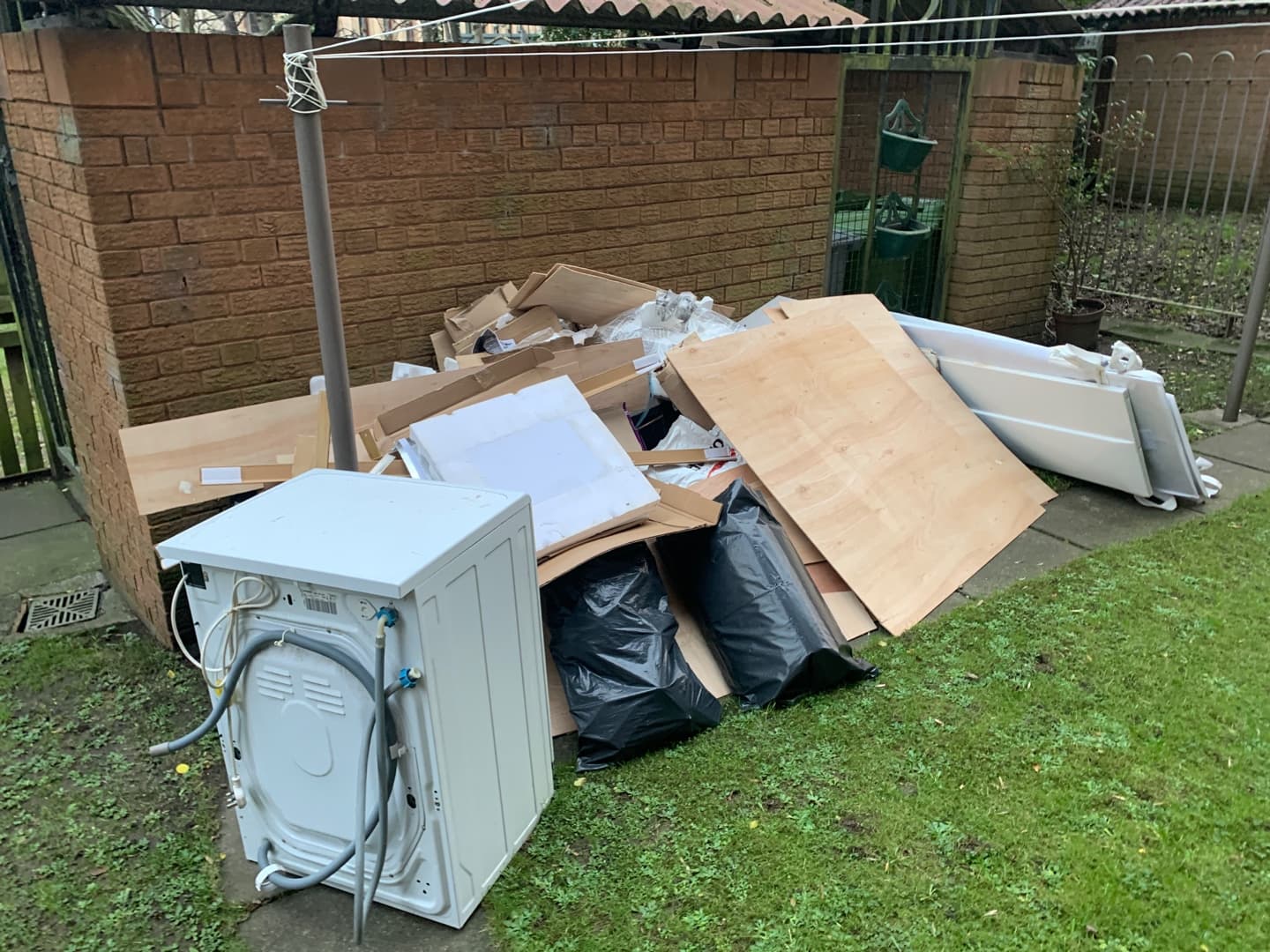 pile of household rubbish and bulky waste outside property in Haringey