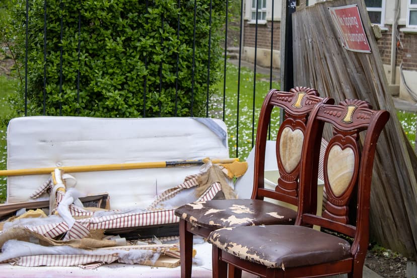 pile of household rubbish and bulky waste outside property in Ealing