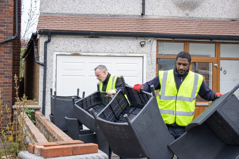 bulky waste collection Solihull workers loading cardboard and household waste into truck