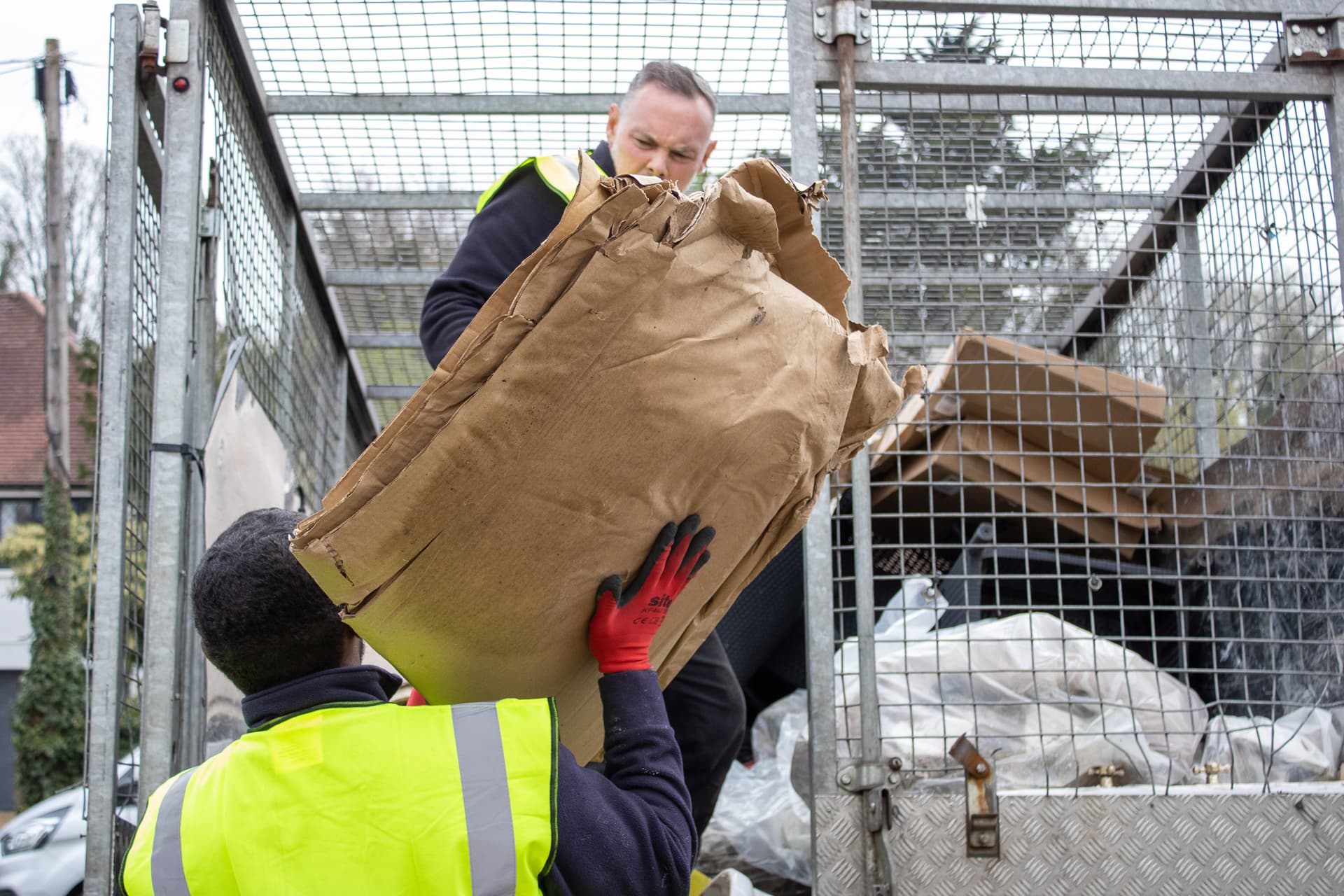 bulky waste collection Southwark workers loading cardboard and household waste into truck