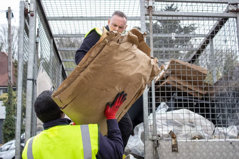 bulky waste collection Southwark workers loading cardboard and household waste into truck