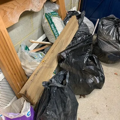 wood waste and bags of rubble, £80