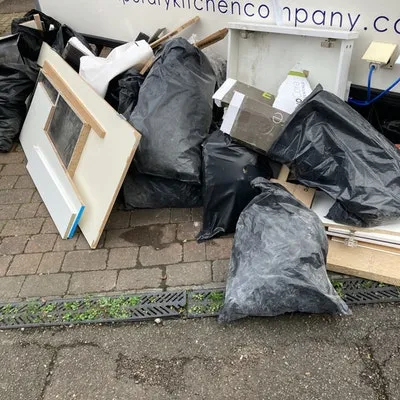 3 bags of tiles and rubbish, £120