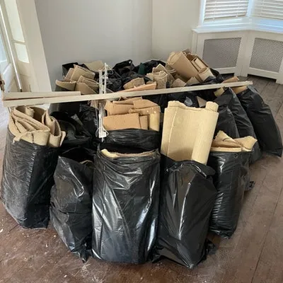bags of old carpet removed for £151